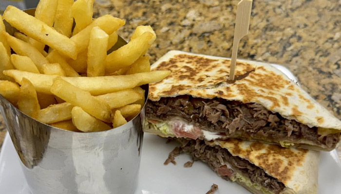 Steak Panini sandwich with fries for lunch or dinner from Carriage Towne in Kingston, NH Steak Panini sandwich with fries for lunch or dinner from Carriage Towne in Kingston, NH
